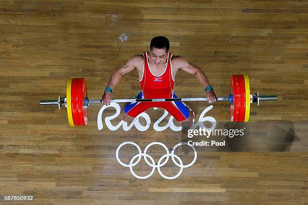 Myong Hyok Kim of Republic of Korea competes during the Men's 69kg Group A Weightlifting on Day 4 of the Rio 2016 Olympic Games at the Riocentro -...