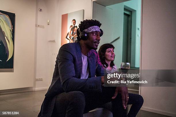 Amar'e Stoudemire watches a video during a contemporary art exhibition at Ana Tiho center on August 9, 2016 in Jerusalem, Israel. Stoudemire, who has...