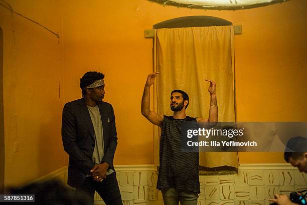 Amar'e Stoudemire speaks with other guests during a contemporary art exhibition at Ana Tiho center on August 9, 2016 in Jerusalem, Israel....