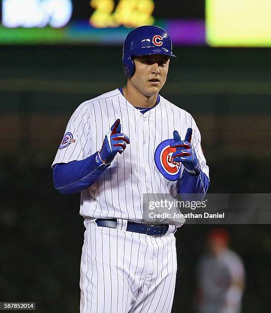Anthony Rizzo of the Chicago Cubs points to the bench after hitting a double in the 4th inning against the Los Angeles Angels at Wrigley Field on...