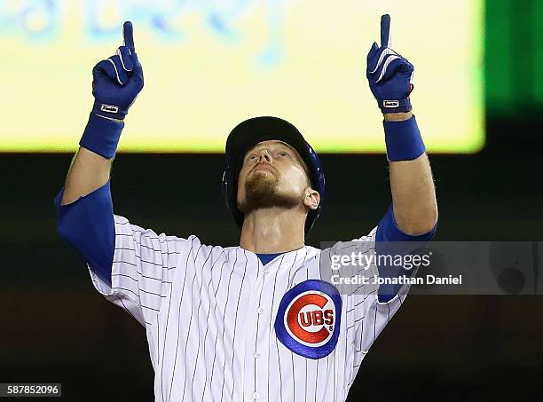 Ben Zobrist of the Chicago Cubs celebrates his a run scoring double in the 4th inning against the Los Angeles Angels at Wrigley Field on August 9,...