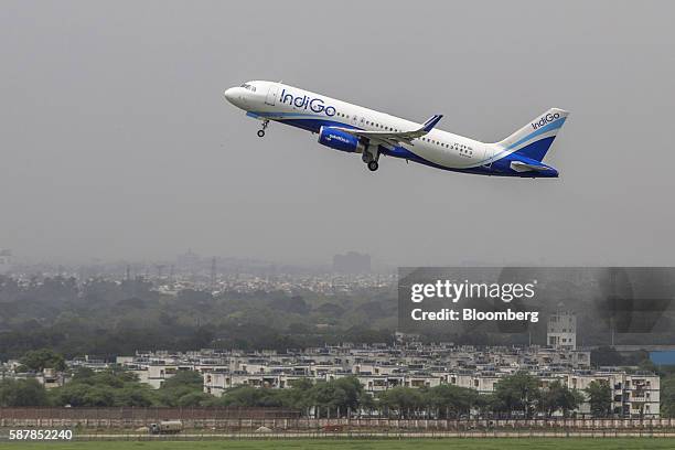 An aircraft operated by IndiGo, a unit of Interglobe Enterprises Ltd., is seen from a control tower as it takes off at Indira Gandhi International...