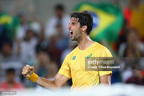 Thomaz Bellucci of Brazil reacts after defeating Pablo Cuevas of Uruguay in a Men's Singles Second Round match on Day 4 of the Rio 2016 Olympic Games...