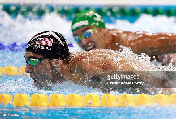 Michael Phelps of the United States leads Chad le Clos of South Africa in the Men's 200m Butterfly Final on Day 4 of the Rio 2016 Olympic Games at...