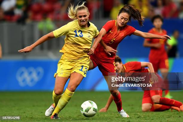 Sweden player Fridolina Rolfo vies for the ball with China player Wu Haiyan during the Rio 2016 Olympic Games First Round Group E women's football...