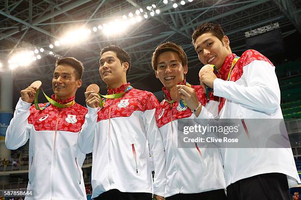 Bronze medalists Kosuke Hagino, Naito Ehara, Yuki Kobori and Takeshi Matsuda of Japan pose during the medal presentation for the Men's 4 x 200m...