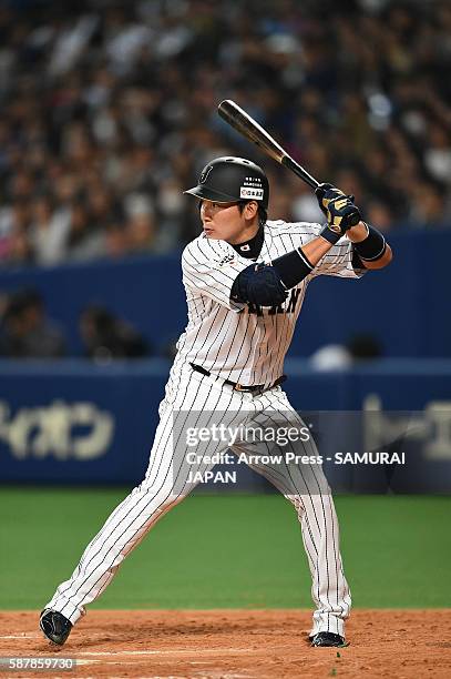 Outfielder Yoshihiro Maru of Japan bats during the international friendly match between Japan and Chinese Taipei at the Nagoya Dome on March 5, 2016...