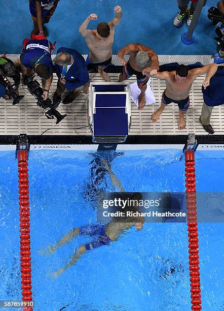 United States Team celebrate winning gold in the Men's 4 x 200m Freestyle Relay Final on Day 4 of the Rio 2016 Olympic Games at the Olympic Aquatics...