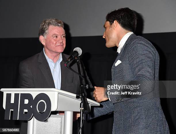 Senior VP of the Boys & Girls Club Kevin McCartney presents HBO Sports Executive VP Peter Nelson with a check onstage during a Q&A following the LA...
