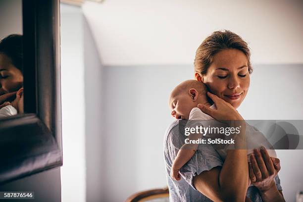 sleeping newborn - carrying baby on shoulders stock pictures, royalty-free photos & images