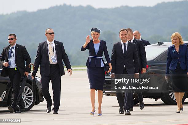 Polish President Andrzej Duda and his wife, First Lady Agata Kornhauser-Duda, the tarmac at Krakow Airport as they await Pope Francis' arrival,...