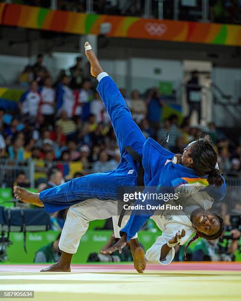 Clarisse Agbegnenou of France throws Anicka van Emden of the Netherlands heavily to the mat for an ippon to win their u63kg contest during day 4 of...