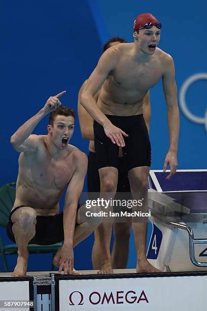 Duncan Scott , Dan Wallace and Stephen Milne of Great Britain react during the Men's 4 x 200m Freestyle Relay on Day 4 of the Rio 2016 Olympic Games...