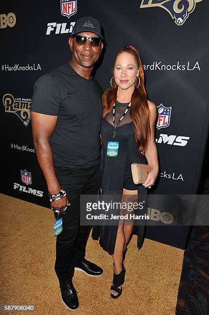 Eric Dickerson and Penny Sutton arrive at the Premiere of HBO and NFL Films 'Hard Knocks: Training Camp With The Los Angeles Rams' at Regal LA Live...