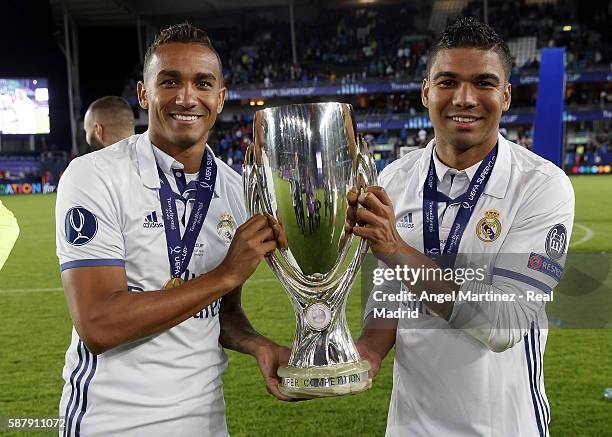 Casemiro and Danilo of Real Madrid celebrate with the trophy after the UEFA Super Cup match between Real Madrid and Sevilla at Lerkendal Stadion on...