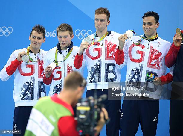 Stephen Milne, Duncan Scott, Dan Wallace, James Guy of Team Great Britain celebrate winning the silver medal during the medal ceremony of the men's...