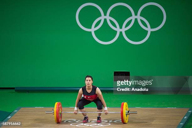 Mehtap Kurnaz of Turkey competes during the Women's 63kg Group B Weightlifting contest on Day 4 of the Rio 2016 Olympic Games at the Riocentro -...