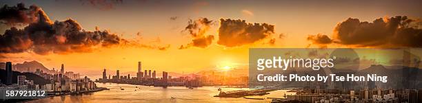 aerial panorama of hong kong cityscape at sunset - hong kong harbour stock pictures, royalty-free photos & images