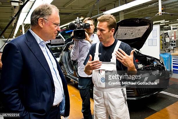 Wolfsburg, Germany Assembly of VW vehicles Golf 7 and electric car E-Golf in Volkswagen Plant on August 09, 2016 in Wolfsburg, Germany.