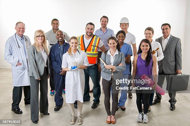 professionals standing together - varierande sysselsättningar bildbanksfoton och bilder