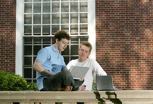 Mark Zuckerberg and Chris Hughes creaters "Facebook" photographed at Eliot House at Harvard University, Cambridge, MA. On May 14, 2004. Facebook was...