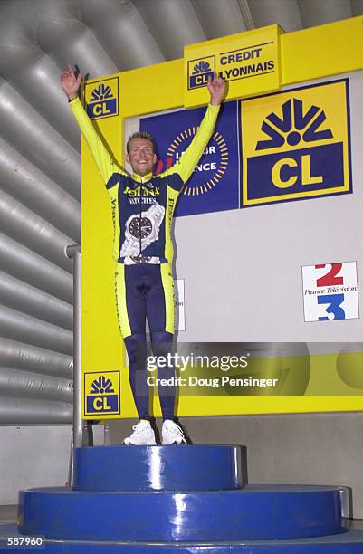 Christophe Moreau of France and riding for the Festina team takes the podium after winning the Prologue of the 2001 Tour de France in Dunkerque,...