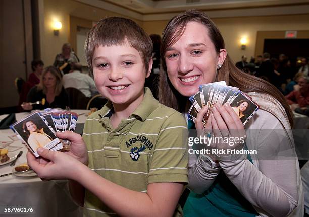 Young supporters of potential Presidential candidate Congresswoman Michele Bachmann of Minnesota passing out "Michele Bachmann trading cards" as...