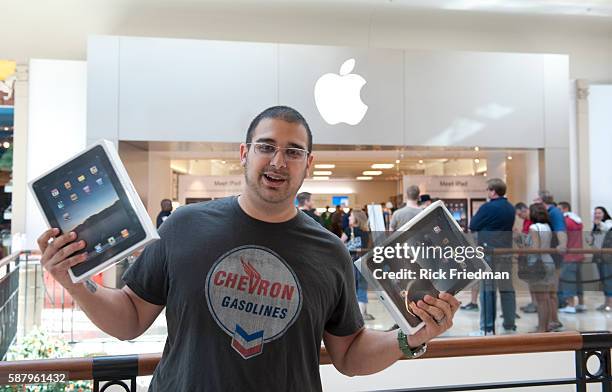Mike Niles of W. Palm Beach, FL, holding his 2 new Apple iPads at the Apple store West Palm Beach, FL on April 3 , 2010.