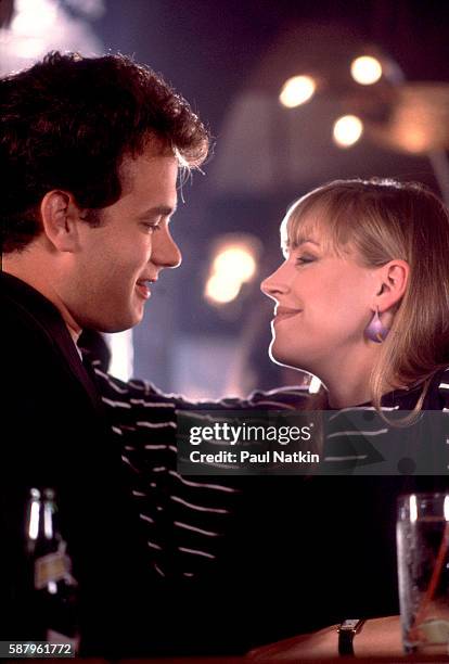 Actor Tom Hanks and actress Bess Armstrong on the set of the Thompson Twins music video for the theme song of the movie 'Nothing In Common,' Chicago,...