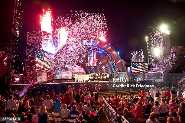 The Boston Pops orchestra performing with the US Navy Sea Chanters at the Hatch Shell on the Charles River Esplanade during the dress rehearsal for...