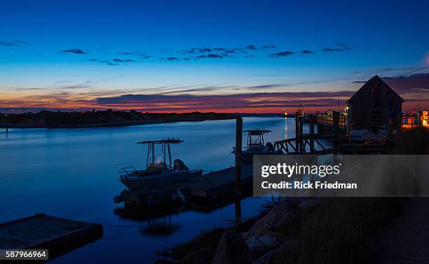 Sunset over Menemsha Sound in the town of Chilmark on Martha's Vineyard, MA over looking beach in the town of Aquinnah, formerly known at Gay Head on...