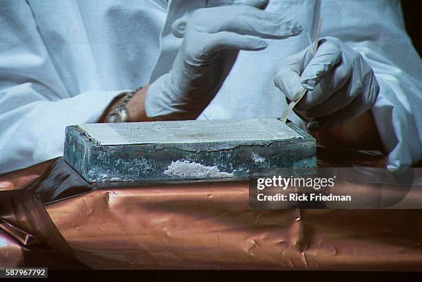 Pamela Hatchfield, of the Museum of Fine Arts, Boston atthe holding the cover after opening a time capsule that was the cornerstone of the...