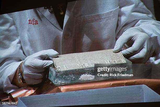 Pamela Hatchfield, of the Museum of Fine Arts, Boston removing a newspaper after opening a time capsule that was the cornerstone of the Massachusetts...