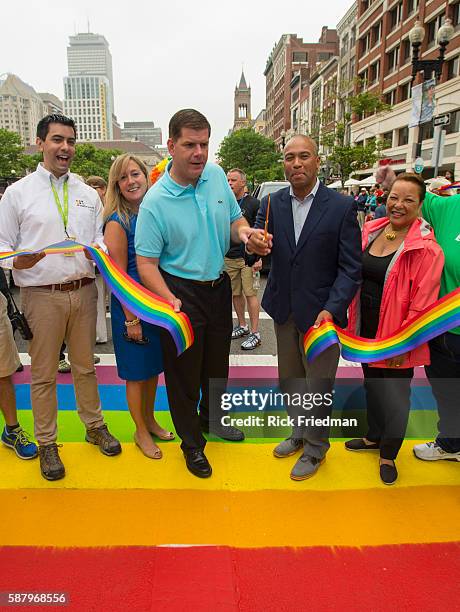 Boston Mayor Marty Walsh and MA Governor Deval Patrick cut the ribbon to open the Boston Pride Parade on June 14, 2014. Lorrie Higgins, Mayor Walsh's...