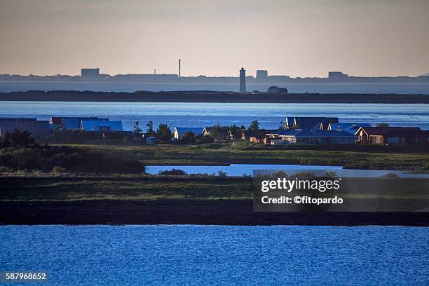 landscape from reykjavik and lighthouse and grotta island in background - neptune's grotto stock pictures, royalty-free photos & images