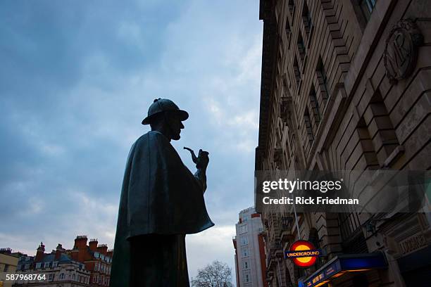 The statue of Sherlock Homes by sculptor, John Doubleday, stands near the site of the fictional detective's home at 221B Baker Street in London, UK...
