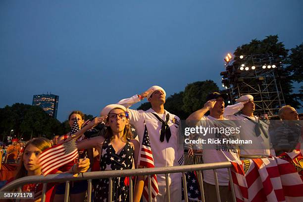 Megan Schindler, age 13 of Stow, OH and U.S. Navy Petty Officer 1st Class Jason Thompson of Detroit, MI singing the National Anthem during Boston...