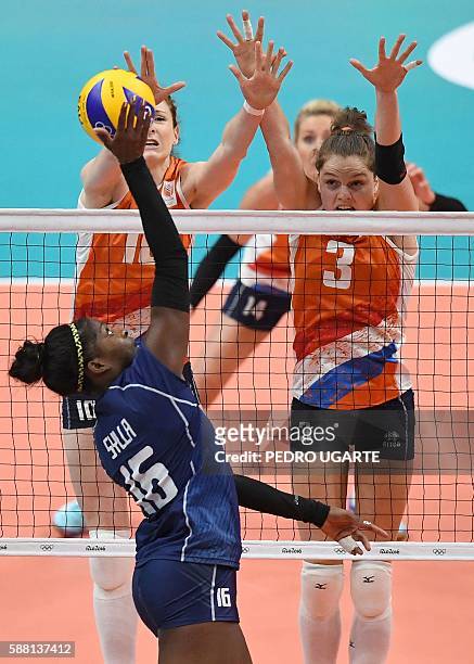 Italy's Myriam Fatime Sylla plays a shot towards Netherlands' Yvon Belien during the women's qualifying volleyball match between Italy and the...