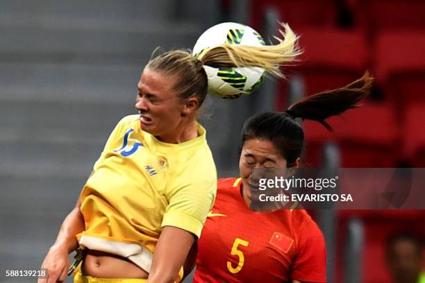 Sweden's footballer Fridolina Rolfo vies for the ball with China's Wu Haiyan during the Rio 2016 Olympic Games first Round Group E Women's football...
