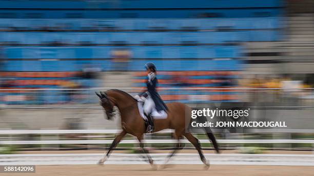 Dominican Republic's Yvonne Losos de Muniz on Foco Loco W performs her routine during the Equestrian's Dressage Grand Prix event of the 2016 Rio...