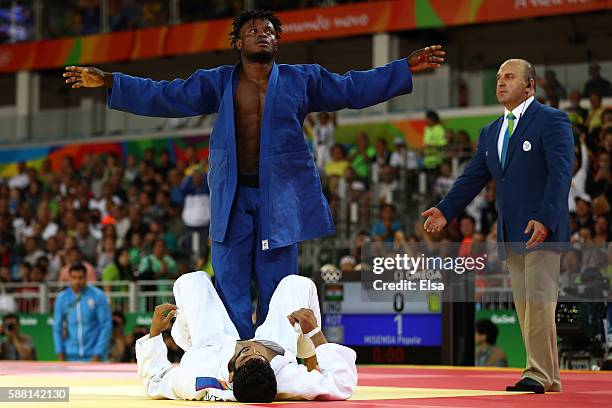 Popole Misenga of the Refugee Olympic Team celebrates after defeating Avtar Singh of India during a Men's -90kg bout on Day 5 of the Rio 2016 Olympic...