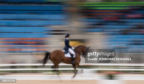 Dominican Republic's Yvonne Losos de Muniz on Foco Loco W performs her routine during the Equestrian's Dressage Grand Prix event of the 2016 Rio...
