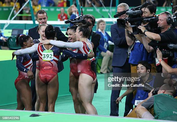 Team USA - Simone Biles, Gabrielle Douglas, Lauren Hernandez, Madison Kocian and Alexandra Raisman - celebrates winning the gold medal in the...