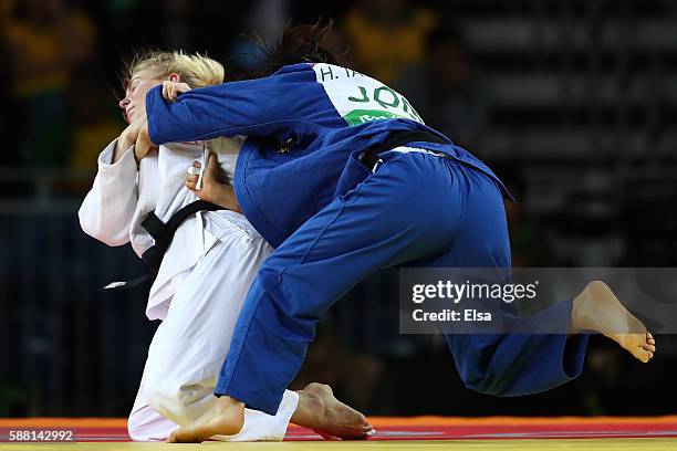 Kim Polling of the Netherlands competes against Haruka Tachimoto of Japan during a Women's -70kg bout on Day 5 of the Rio 2016 Olympic Games at...