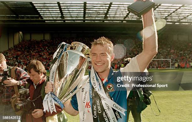 Blackburn Rovers striker Alan Shearer celebrating with the FA Premier League Championship trophy following their match against Liverpool at Anfield,...