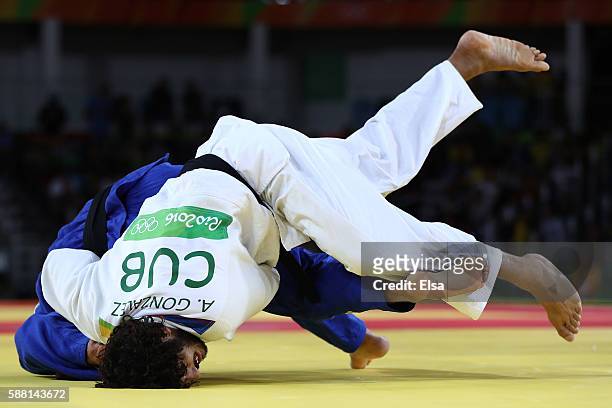 Quedjau Nhabali of the Ukraine competes against Asley Gonzalez of Cuba during a Men's -90kg bout on Day 5 of the Rio 2016 Olympic Games at Carioca...