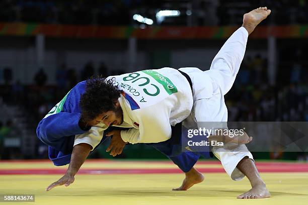 Quedjau Nhabali of the Ukraine competes against Asley Gonzalez of Cuba during a Men's -90kg bout on Day 5 of the Rio 2016 Olympic Games at Carioca...