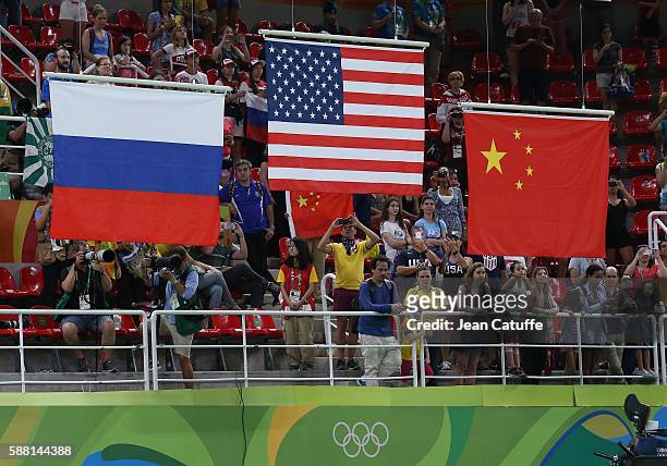 Illustration of the flags - silver medal for Russia, gold medal for USA, bronze medal for China - during the medal ceremony for the Artistic...