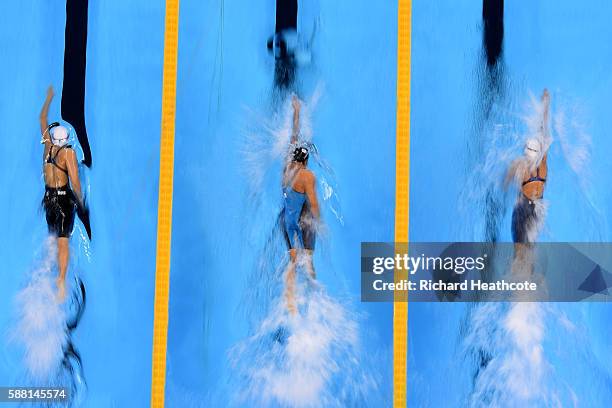 Veronika Popova of Russia, Erika Ferraioli of Italy and Katarzyna Wilk of Poland compete in the Women's 100m Freestyle heat on Day 5 of the Rio 2016...