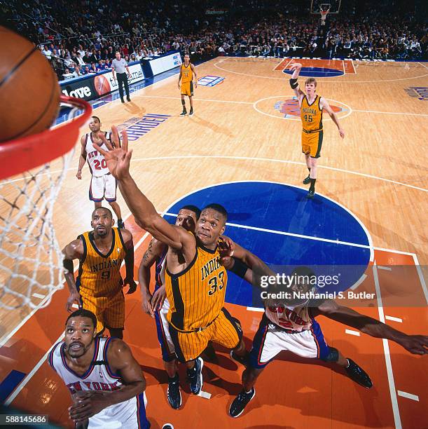 Antonio Davis of the Indiana Pacers drives to the basket against the New York Knicks during the Eastern Conferece Finals on June 4, 1999 at Madison...